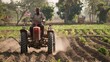 Traditional Indian farmer plowing his vast field with a modern tractor in rural India