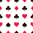 Seamless pattern with black and red playing cards suits