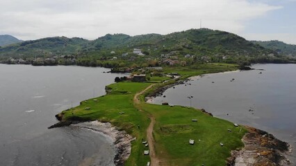 Sticker - Aerial view of promontory on the thin peninsula in the sea coastline.