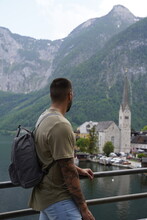 Unrecognizable Young Male Tourist Visiting The Beautiful Village Hallstatt In Austria