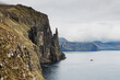 Dramatic cliffs Trollkonufingur, the witches finger, in Faroe Islands, Vagar island, Northern Europe, viewpoint