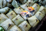 Fototapeta Most - Top view of Zongzi, The glutinous rice wrapped in Lotus leaf, focus selective