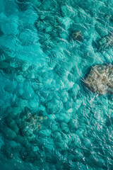 Wall Mural - sea surface. aerial view of blue clean sea. vertical summer background. copy space.