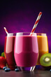 delicious set of fresh fruit juices, smoothies, cocktails on a dark purple background, vertical