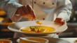 Generative AI : close up of male chef with flower serving plate of pumpkin cream soup at restaurant kitchen