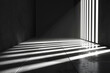 A black and white black of an empty hallway using only lines and light for background