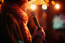 Confident Woman Holding A Microphone In Her Hand, Poised For Performance At An Open Mic Night Event