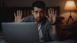 Hispanic young man using computer laptop sitting on the bed with open hand doing stop sign with serious and confident expression.