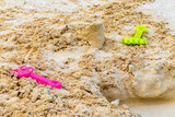 Fototapeta Most - Beach toys colorful bucket shovel on white sand Caribbean Mexico.