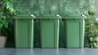 Three green garbage bins lined up against a textured green wall with plant shadows reflecting on the surface, conveying a concept of eco-friendly waste management and recycling. 