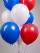 Fountain of air balloons with helium color tricolor white blue red on a gray background