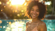 A woman with curly hair graces the poolside with her luminous smile as the sun sets, creating a sparkling backdrop