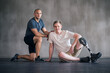 © peopleimages.com - Trainer, person with a disability and prosthetic leg and posing in physiotherapy, studio and gym ball. Male people, physiotherapist and amputee for wellness, fitness and exercise in sports center