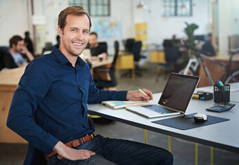 Workplace, portrait of man or software developer with computer for testing programs, applications and career in office. Businessman, notebook and laptop for coding data with smile or professional