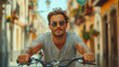 © MariКа - Man in sunglasses on bicycle in city front view
