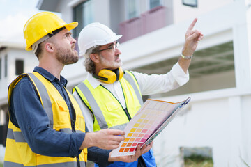 Foreman and client discuss on a building plan and construction.