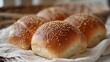 A variety of bakery items including bread loaf, sandwich bread, sliced bread, burger bun, soft roll, artisan bread, and other baked goods.