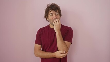 Sticker - Anxious, stressed young hispanic man in t-shirt, biting nails over pink isolated background. nervous guy looking terrified - a portrait of anxiety problem.