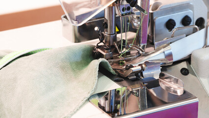 Aufkleber - Professional sewing machine and sews garments,  textile fabric production industrial concept background