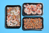 Fototapeta  - Plastic packages with seafood