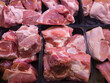 pieces of different sizes of chilled pork on display