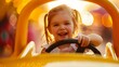 Little girl gleefully drives a toy car in a vibrant yellow setting, capturing the essence of childhood joy and exploration.