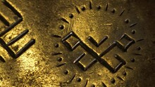 Gold Plate With Engraved Inscriptions And Symbols. Latvian Ornaments Or Patterns, Are Mythological Signs That Have Changed Over The Course Of History.