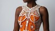 model posing in studio. a orange paper cut out of a woman's torso.