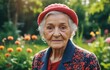 Portrait of an elderly woman in the garden at sunny day.