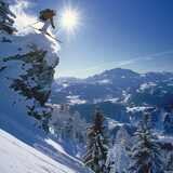 Fototapeta  - Extreme downhill skier in the mountains