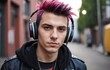 A stylish young man with pink hair wearing headphones and trendy eyewear