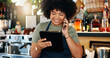 © peopleimages.com - Tablet, bartender and happy woman on cellphone call, discussion and order alcohol stock, store delivery or distribution. Commerce, phone and small business owner consulting on drinks supply chain