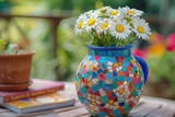 Fototapeta Big Ben - Colorful mosaic vase with white daisies. Ideal for home decor and gardening websites, floral arrangement workshops, and social media posts.