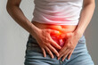 Woman experiencing stomach pain highlighted in red