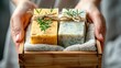 Close up of woman holding handmade soap with in wooden box