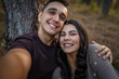 Man and woman young adult couple in nature self portrait selfie ugc