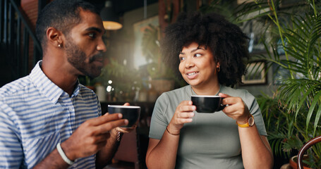 Wall Mural - Friends, cheers and coffee in restaurant with talking, bonding together and relax on break on vacation. Young man, woman and communication by tea, happiness and care for cappuccino on holiday in cafe