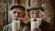 Two men with beards and glasses are holding glasses of milk