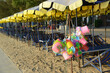 Beach deck chairs and umbrella in the morning at Cha-am Beach and Plastic objects used for scooping sand, such as cans and buckets. Located at Phetchaburi Province in Thailand.