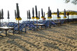 Beach deck chairs and umbrella in the morning at Cha-am Beach.