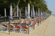 Beach deck chairs and umbrella in the morning at Cha-am Beach.