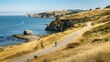 A scenic coastal bike ride along a winding cliffside path, with cyclists enjoying the cool sea breeze and panoramic views of the rugged coastline.