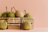 Fototapeta  - ripe durians in craft boxes on the table. Smelly fruit. Thailand. Vietnam. Background. Postcard