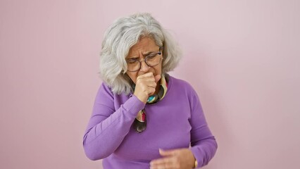 Sticker - Middle-aged woman, grey-haired and bespectacled, standing over pink wall, coughing painfully; the sting of cold or bronchitis. unwell, yet beautiful, her eyes speak health care urgency.