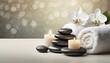 Spa ambience with stones candles and towels