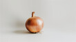 Whole onion with papery skin on white background. Layers visible, depth of flavor highlighted. Design for fundamental cooking role, flavor enhancer concept.
