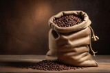 Fototapeta  - An old sack of coffee beans on a wooden floor, horizontal composition