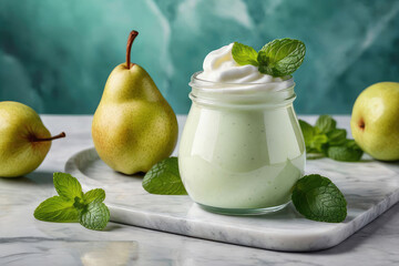 Wall Mural - Yogurt or parfait with pear sauce and pears in glass jar on a white marble table, summer breakfast.
