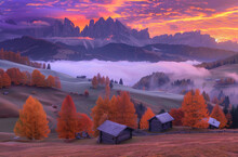 A Picturesque Autumn Sunrise Over The Dolomites, With Misty Mountains And Golden Trees In Shades Of Orange And Pink, With Small Wooden Buildings Nestled Among Rolling Hills Below