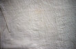 A photo of the texture of a textile fabric. White fabric background.